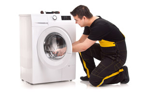 man working on a dryer